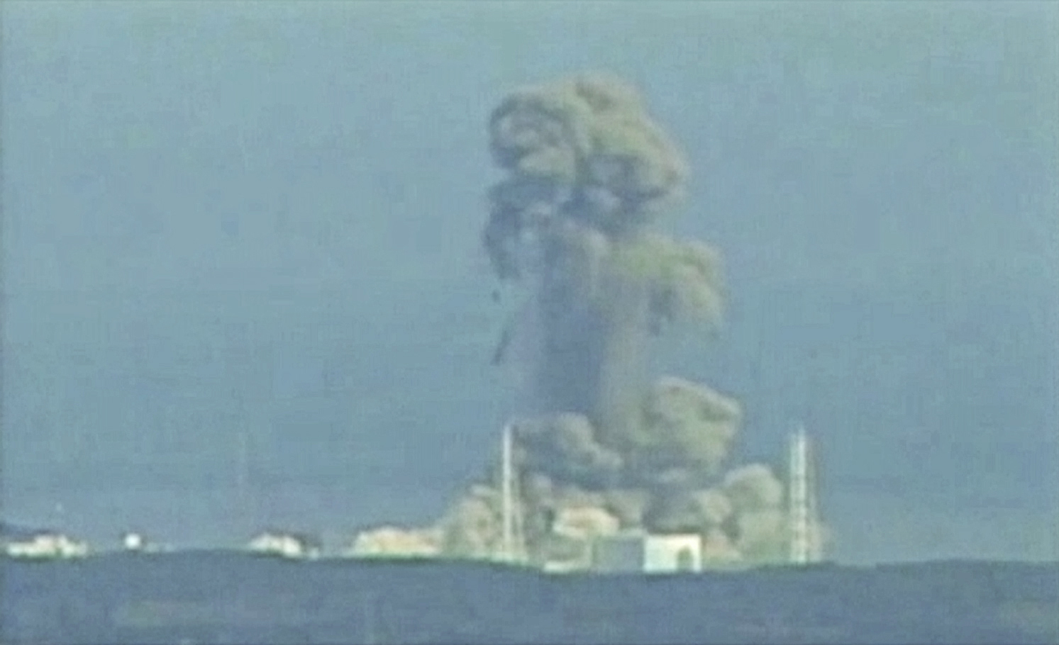 Smoke rises from Fukushima Daiichi nuclear power complex in this still image from video footage
